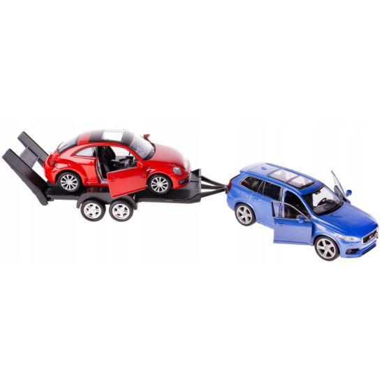 Metalowy model Volvo XC90 z otwartymi drzwiami ciągnący lawetę z czerwonym VW Beetle z opuszczonymi najazdami